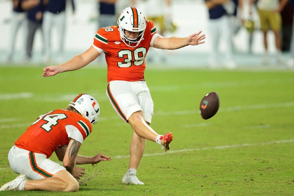 Aug 31, 2025; Miami Gardens, Florida, USA; Miami Hurricanes place kicker Carter Davis (39) kicks the game winning field goal against the Notre Dame Fighting Irish at Hard Rock Stadium. Mandatory Credit: Sam Navarro-Imagn Images