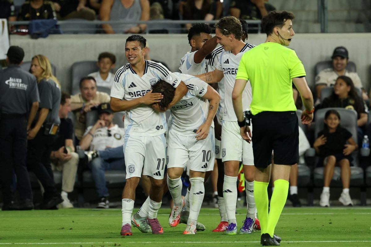 Aug 31, 2025; Los Angeles, California, USA;  San Diego FC midfielder Anders Dreyer (10) celebrates with forward Hirving Lozano (11) after scoring a goal during the second half against LAFC at BMO Stadium. Mandatory Credit: Kiyoshi Mio-Imagn Images