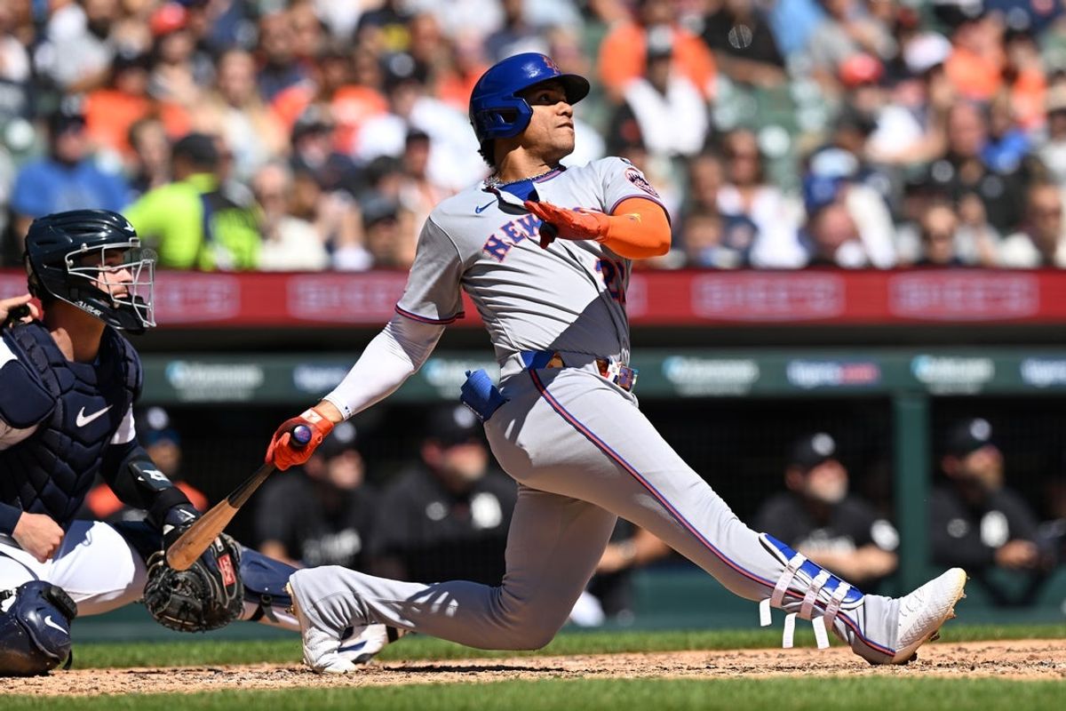 Sep 1, 2025; Detroit, Michigan, USA;  New York Mets right fielder Juan Soto (22) hits a grand slam home run against the Detroit Tigers in the fourth inning at Comerica Park. Mandatory Credit: Lon Horwedel-Imagn Images