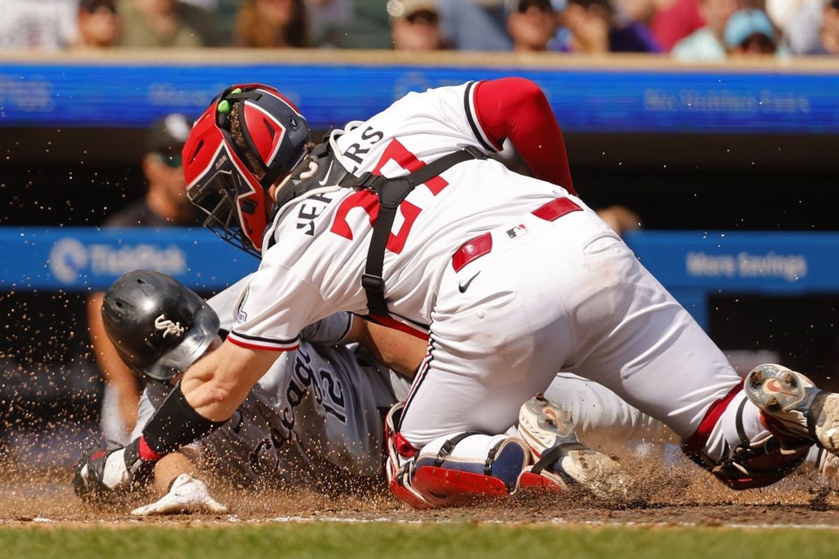 Sep 1, 2025; Minneapolis, Minnesota, USA; Minnesota Twins catcher Ryan Jeffers (27) tags out Chicago White Sox shortstop Colson Montgomery (12) on a fielder's choice hit by second baseman Chase Meidroth (not pictured) in the sixth inning at Target Field. Mandatory Credit: Bruce Kluckhohn-Imagn Images