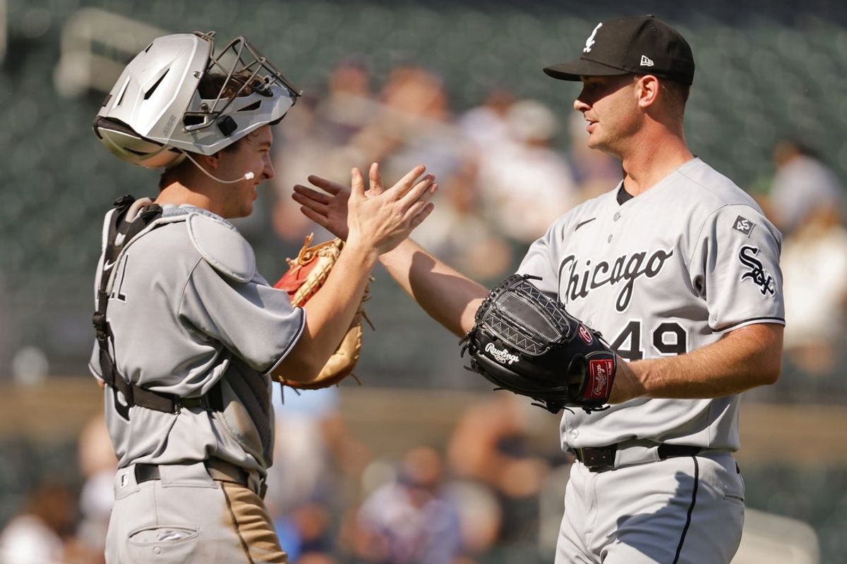 Sep 1, 2025; Minneapolis, Minnesota, USA; Chicago White Sox catcher Kyle Teel (8) and relief pitcher Jordan Leasure (49) celebrate the win over the Minnesota Twins at Target Field. Mandatory Credit: Bruce Kluckhohn-Imagn Images