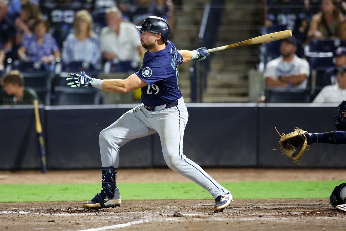 Sep 1, 2025; Tampa, Florida, USA; Seattle Mariners catcher Cal Raleigh (29) singles against the Tampa Bay Rays in the eighth inning at George M. Steinbrenner Field. Mandatory Credit: Nathan Ray Seebeck-Imagn Images