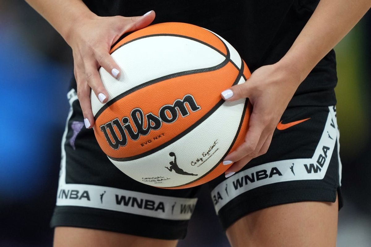 Aug 31, 2025; San Francisco, California, USA; Golden State Valkyries guard Kaitlyn Chen (2) holds a ball as the WNBA logo appears on the ball and shorts before the game against the Indiana Fever at Chase Center. Mandatory Credit: Darren Yamashita-Imagn Images