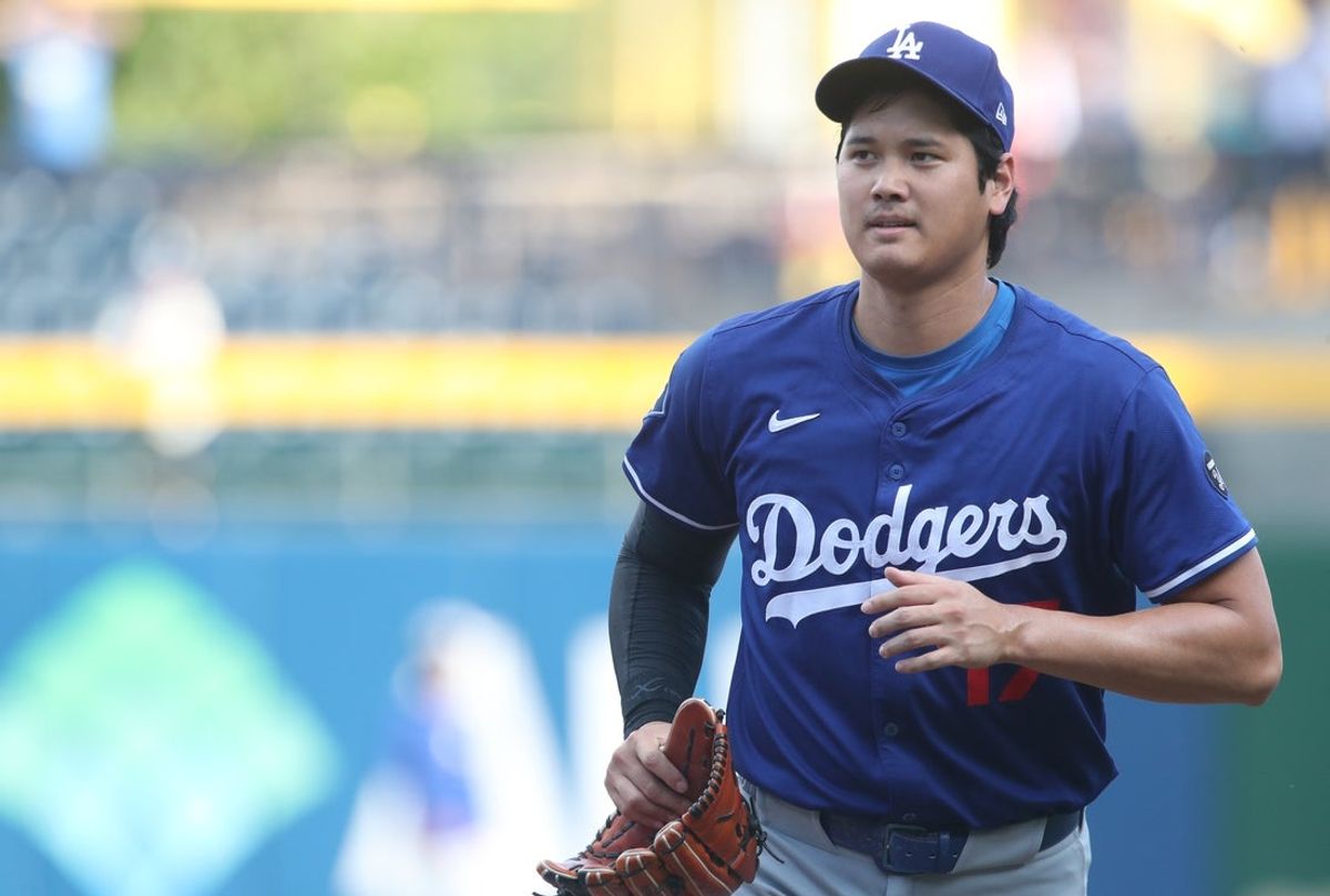 Sep 2, 2025; Pittsburgh, Pennsylvania, USA;  Los Angeles Dodgers two-way player Shohei Ohtani (17) jogs in from the outfield before the game against the Pittsburgh Pirates at PNC Park. Mandatory Credit: Charles LeClaire-Imagn Images