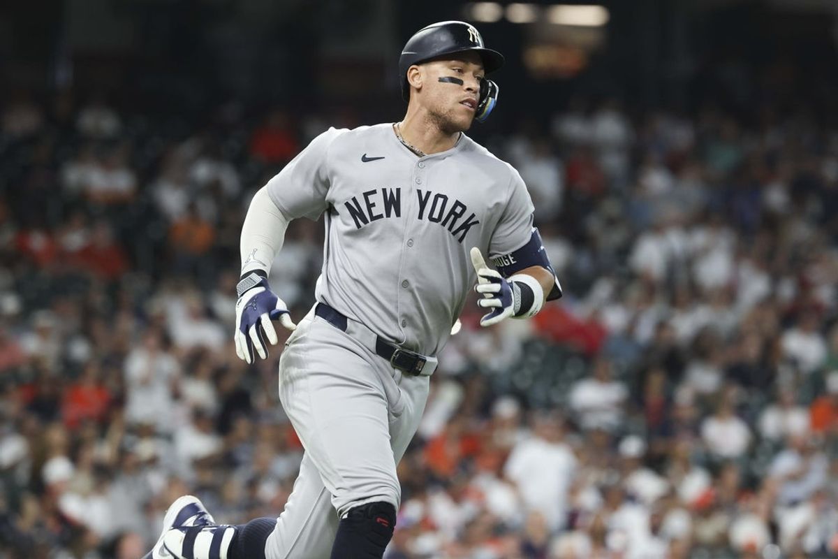 Sep 2, 2025; Houston, Texas, USA; New York Yankees designated hitter Aaron Judge (99) runs to first base on a single during the first inning against the Houston Astros at Daikin Park. Mandatory Credit: Troy Taormina-Imagn Images
