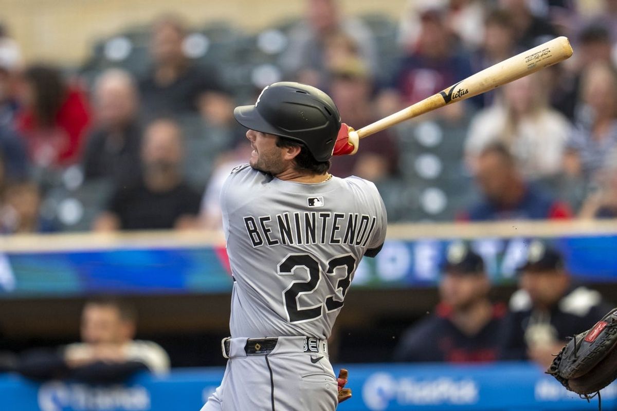 Sep 2, 2025; Minneapolis, Minnesota, USA; Chicago White Sox left fielder Andrew Benintendi (23) hits a solo home run against the Minnesota Twins in the second inning at Target Field. Mandatory Credit: Jesse Johnson-Imagn Images