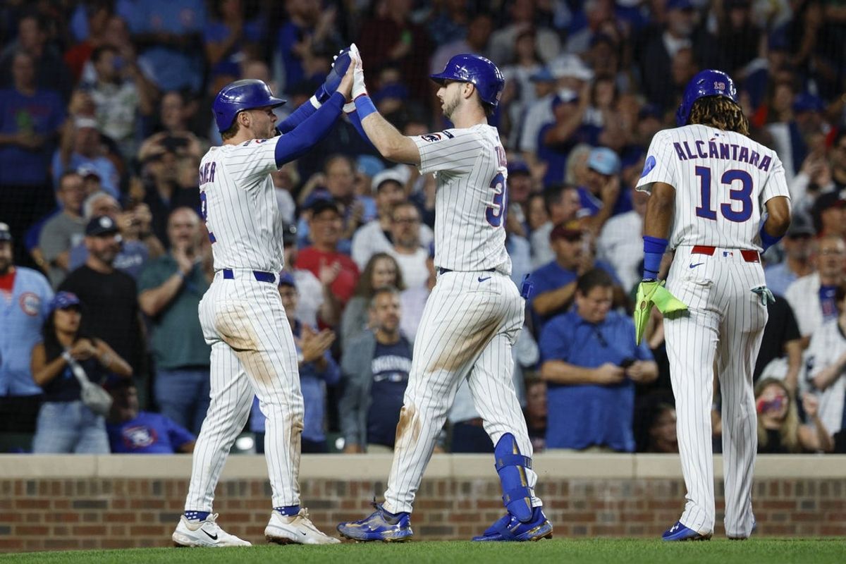 Sep 5, 2025; Chicago, Illinois, USA; Chicago Cubs right fielder Kyle Tucker (30) celebrates with second baseman Nico Hoerner (2) after hitting a three-run home run against the Atlanta Braves during the third inning at Wrigley Field. Mandatory Credit: Kamil Krzaczynski-Imagn Images