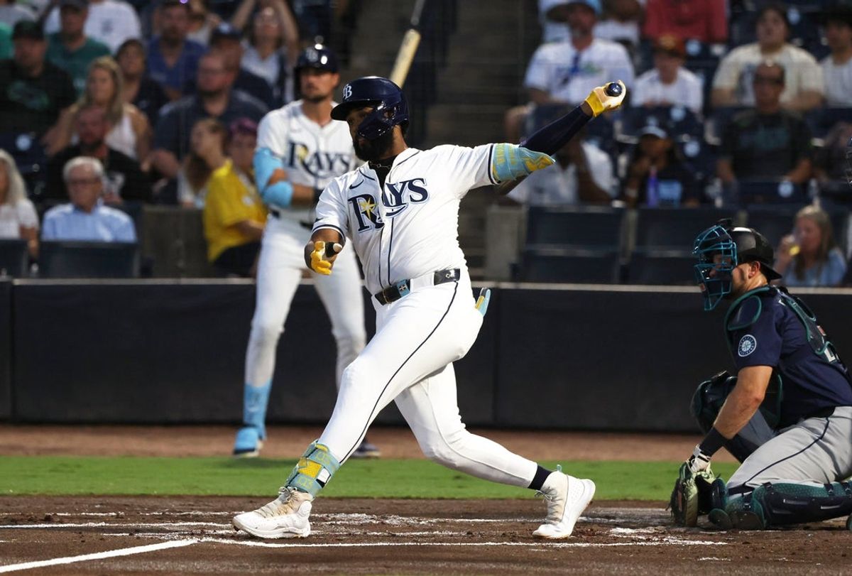 Sep 2, 2025; St. Petersburg, Florida, USA;  Tampa Bay Rays third base Junior Caminero (13) hits an RBI single during the first inning against the Seattle Mariners at George M. Steinbrenner Field. Mandatory Credit: Kim Klement Neitzel-Imagn Images