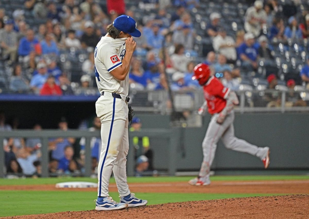 Sep 2, 2025; Kansas City, Missouri, USA;  Kansas City Royals starting pitcher Michael Lorenzen (24) reacts after giving up a two run home run to Los Angeles Angels designated hitter Jo Adell (7) in the sixth inning at Kauffman Stadium. Mandatory Credit: Peter Aiken-Imagn Images