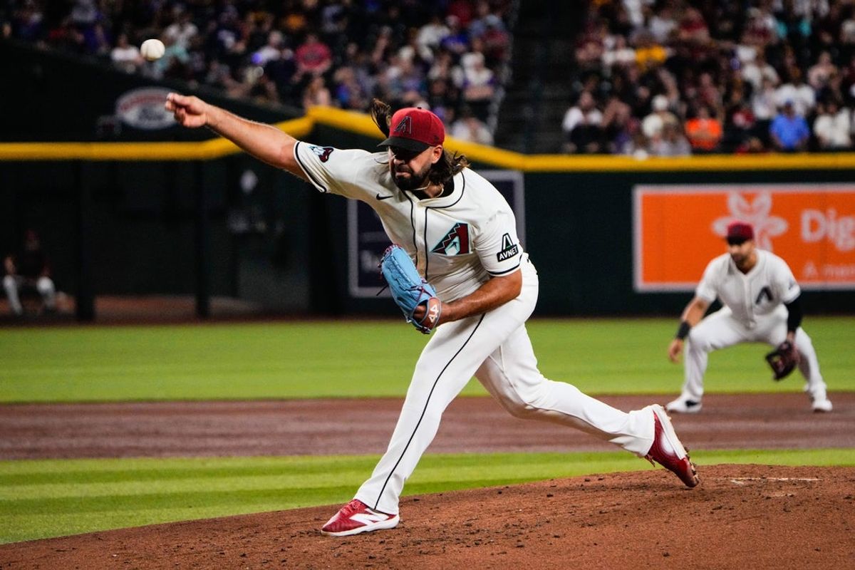 Sep 2, 2025; Phoenix, Arizona, USA; Arizona Diamondbacks pitcher Nabil Crismatt (61) pitches against the Texas Rangers in the third inning of the game at Chase Field. Mandatory Credit: Arianna Grainey-Imagn Images