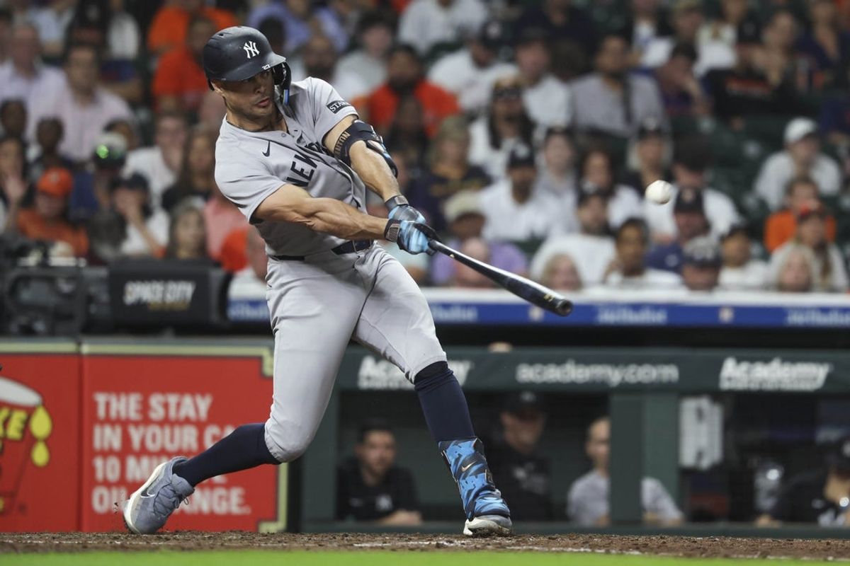 Sep 2, 2025; Houston, Texas, USA; New York Yankees left fielder Giancarlo Stanton (27) bats during the seventh inning against the Houston Astros at Daikin Park. Mandatory Credit: Troy Taormina-Imagn Images