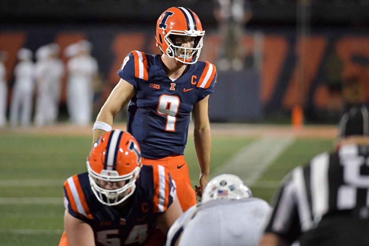 Aug 29, 2025; Champaign, Illinois, USA;  Illinois Fighting Illini quarterback Luke Altmyer (9) takes a snap during the first half against the Western Illinois Leathernecks  at Memorial Stadium. Mandatory Credit: Ron Johnson-Imagn Images