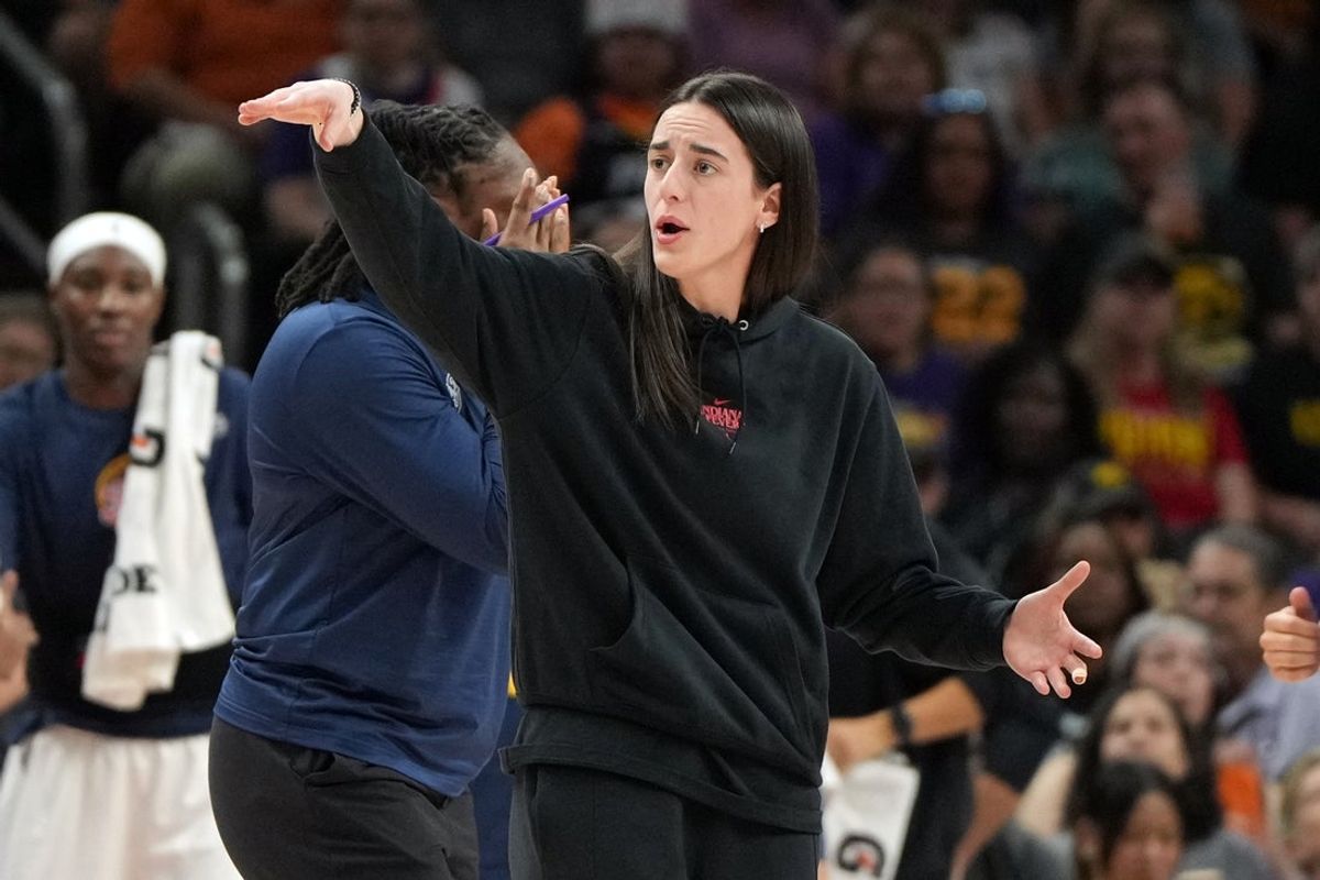 Sep 2, 2025; Phoenix, Arizona, USA; Indiana Fever guard Caitlin Clark (22) reacts to a play against the Phoenix Mercury in the second half at PHX Arena. Mandatory Credit: Rick Scuteri-Imagn Images