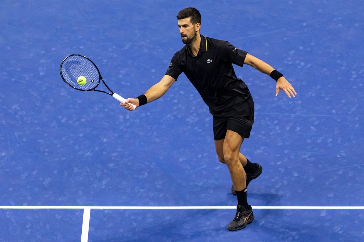 Sep 2, 2025; Flushing, NY, USA; Novak Djokovic of Serbia in action against Taylor Fritz of the United States in the quarterfinal of the men’s singles at the US Open at Arthur Ashe Stadium in Billie Jean King National Tennis Center. Mandatory Credit: Mike Frey-Imagn Images
