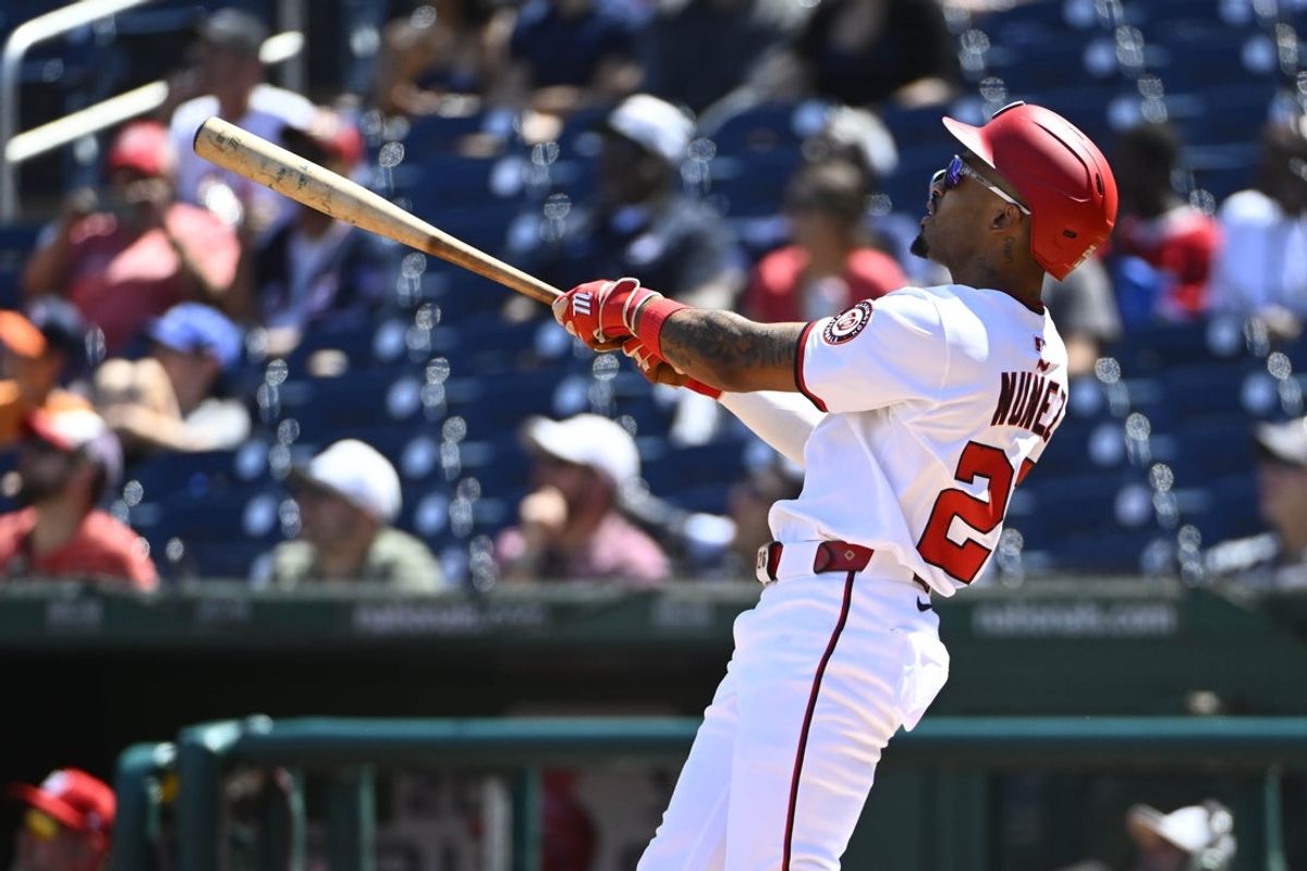 Sep 3, 2025; Washington, District of Columbia, USA; Washington Nationals shortstop Nasim Nunez (26) hits a solo home run against the Miami Marlins during the second inning at Nationals Park. Mandatory Credit: Brad Mills-Imagn Images