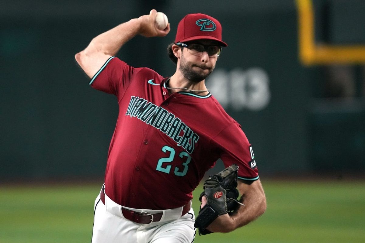 Sep 3, 2025; Phoenix, Arizona, USA; Arizona Diamondbacks pitcher Zac Gallen (23) throws against the Texas Rangers in the first inning at Chase Field. Mandatory Credit: Rick Scuteri-Imagn Images