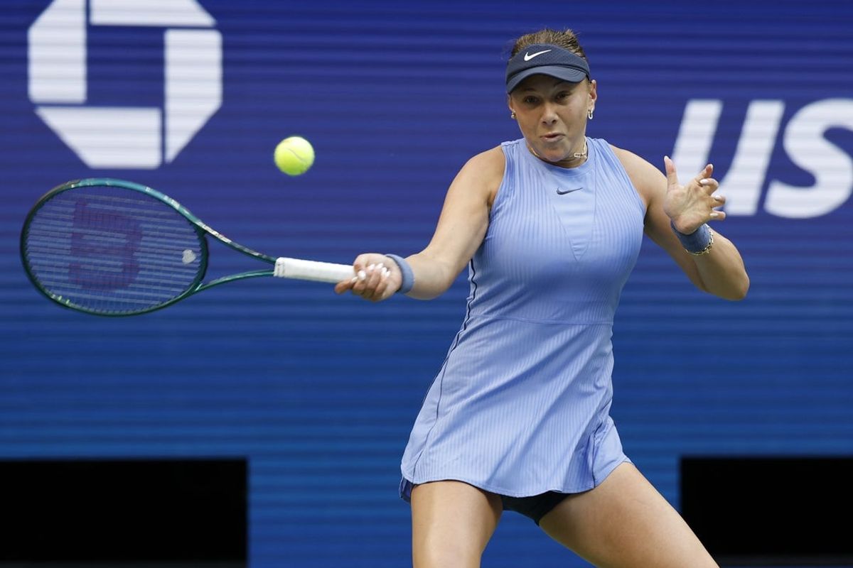 Sep 3, 2025; Flushing, NY, USA; Amanda Anisimova (USA) hits a forehand against Iga Swiatek (POL) (not pictured) on day eleven of the 2025 US Open tennis championships at USTA Billie Jean King National Tennis Center. Mandatory Credit: Geoff Burke-Imagn Images