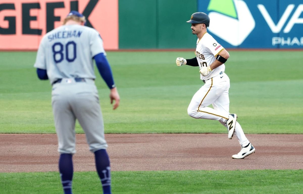 Sep 3, 2025; Pittsburgh, Pennsylvania, USA;  Pittsburgh Pirates right fielder Bryan Reynolds (10) circles the bases on a solo home run against Los Angeles Dodgers starting pitcher Emmet Sheehan (80) during the first inning at PNC Park. Mandatory Credit: Charles LeClaire-Imagn Images