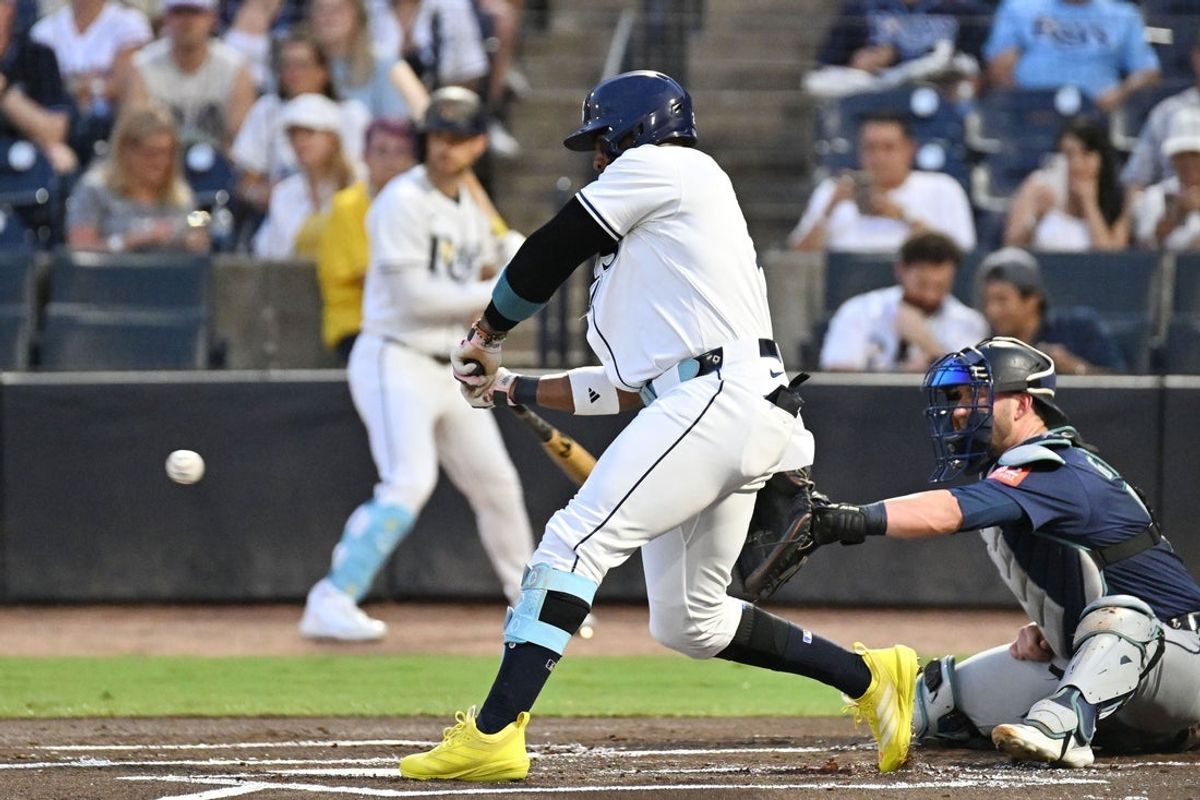 Sep 3, 2025; St. Petersburg, Florida, USA; Tampa Bay Rays designated hitter Yandy Diaz (2) hits a double in the first inning against the Seattle Mariners at George M. Steinbrenner Field. Mandatory Credit: Jonathan Dyer-Imagn Images