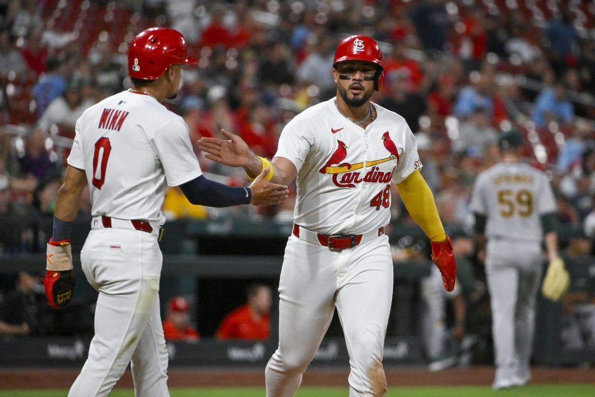 Sep 3, 2025; St. Louis, Missouri, USA;  St. Louis Cardinals designated hitter Ivan Herrera (48) celebrates with shortstop Masyn Winn (0) after they scored against the Athletics during the third inning at Busch Stadium. Mandatory Credit: Jeff Curry-Imagn Images