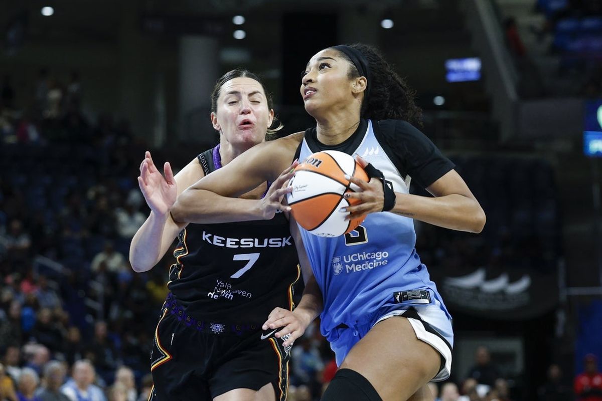 Sep 3, 2025; Chicago, Illinois, USA; Chicago Sky forward Angel Reese (5) drives to the basket against Connecticut Sun forward Haley Peters (7) during the second half at Wintrust Arena. Mandatory Credit: Kamil Krzaczynski-Imagn Images