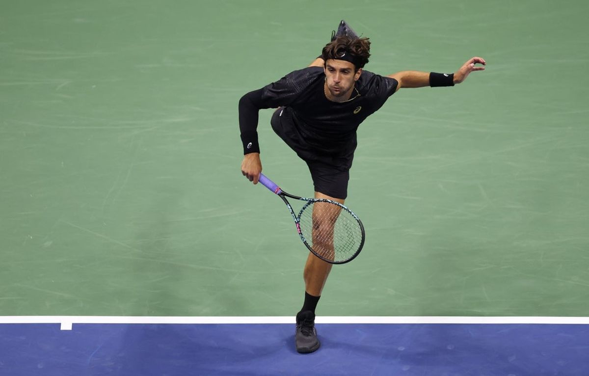 Sep 3, 2025; Flushing, NY, USA; Lorenzo Musetti (ITA) serves against Jannik Sinner (ITA) (not pictured) on day eleven of the 2025 US Open tennis championships at USTA Billie Jean King National Tennis Center. Mandatory Credit: Mike Frey-Imagn Images