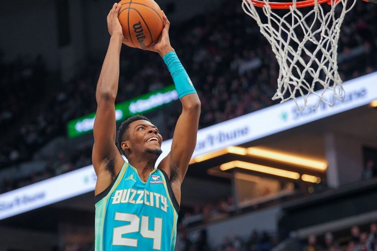 Jan 22, 2024; Minneapolis, Minnesota, USA; Charlotte Hornets forward Brandon Miller (24) dunks against the Minnesota Timberwolves in the third quarter at Target Center.
