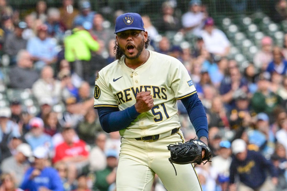 Sep 4, 2025; Milwaukee, Wisconsin, USA;  Milwaukee Brewers starting pitcher Freddy Peralta (51) reacts after striking out Philadelphia Phillies third baseman Alec Bohm (not pictured) with the bases loaded in the fourth inning at American Family Field. Mandatory Credit: Benny Sieu-Imagn Images