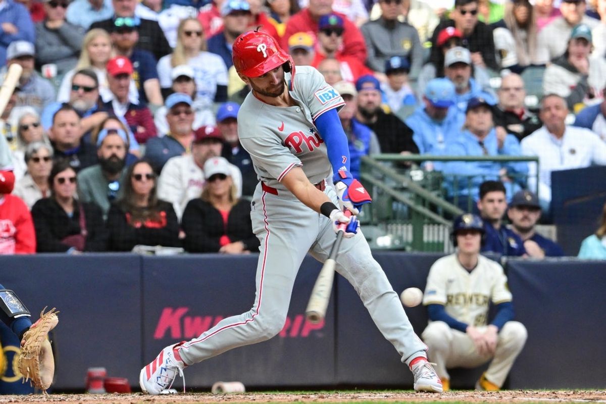 Sep 4, 2025; Milwaukee, Wisconsin, USA;  Philadelphia Phillies shortstop Trea Turner (7) drives in a run with a base hit against the Milwaukee Brewers in the seventh inning at American Family Field. Mandatory Credit: Benny Sieu-Imagn Images