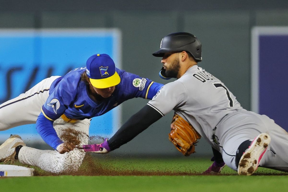 Sep 4, 2025; Minneapolis, Minnesota, USA; Minnesota Twins second baseman Luke Keaschall (15) tags out Chicago White Sox designated hitter Edgar Quero (7) who failed to extend a single into a double in the first inning at Target Field. Mandatory Credit: Bruce Kluckhohn-Imagn Images