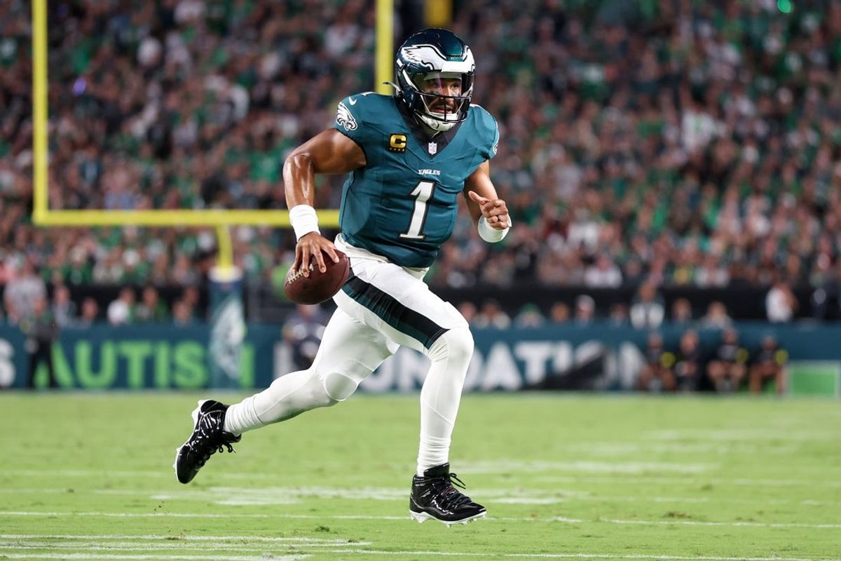 Sep 4, 2025; Philadelphia, Pennsylvania, USA; Philadelphia Eagles quarterback Jalen Hurts (1) carries the ball for a touchdown against the Dallas Cowboys during the second quarter of the game at Lincoln Financial Field. Mandatory Credit: Bill Streicher-Imagn Images
