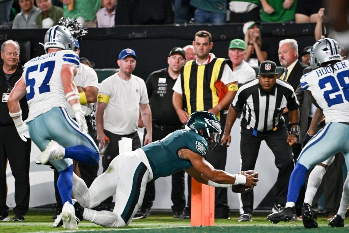 Sep 4, 2025; Philadelphia, Pennsylvania, USA; Philadelphia Eagles quarterback Jalen Hurts (1) scores a touchdown against the Dallas Cowboys during the second quarter of the game at Lincoln Financial Field. Mandatory Credit: Eric Hartline-Imagn Images