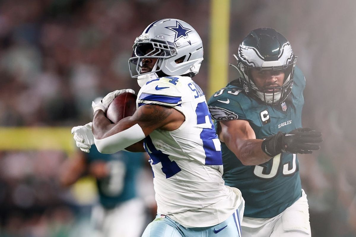 Sep 4, 2025; Philadelphia, Pennsylvania, USA; Dallas Cowboys running back Miles Sanders (24) avoids a tackle by Philadelphia Eagles linebacker Zack Baun (53) during the third quarter of the game at Lincoln Financial Field. Mandatory Credit: Bill Streicher-Imagn Images