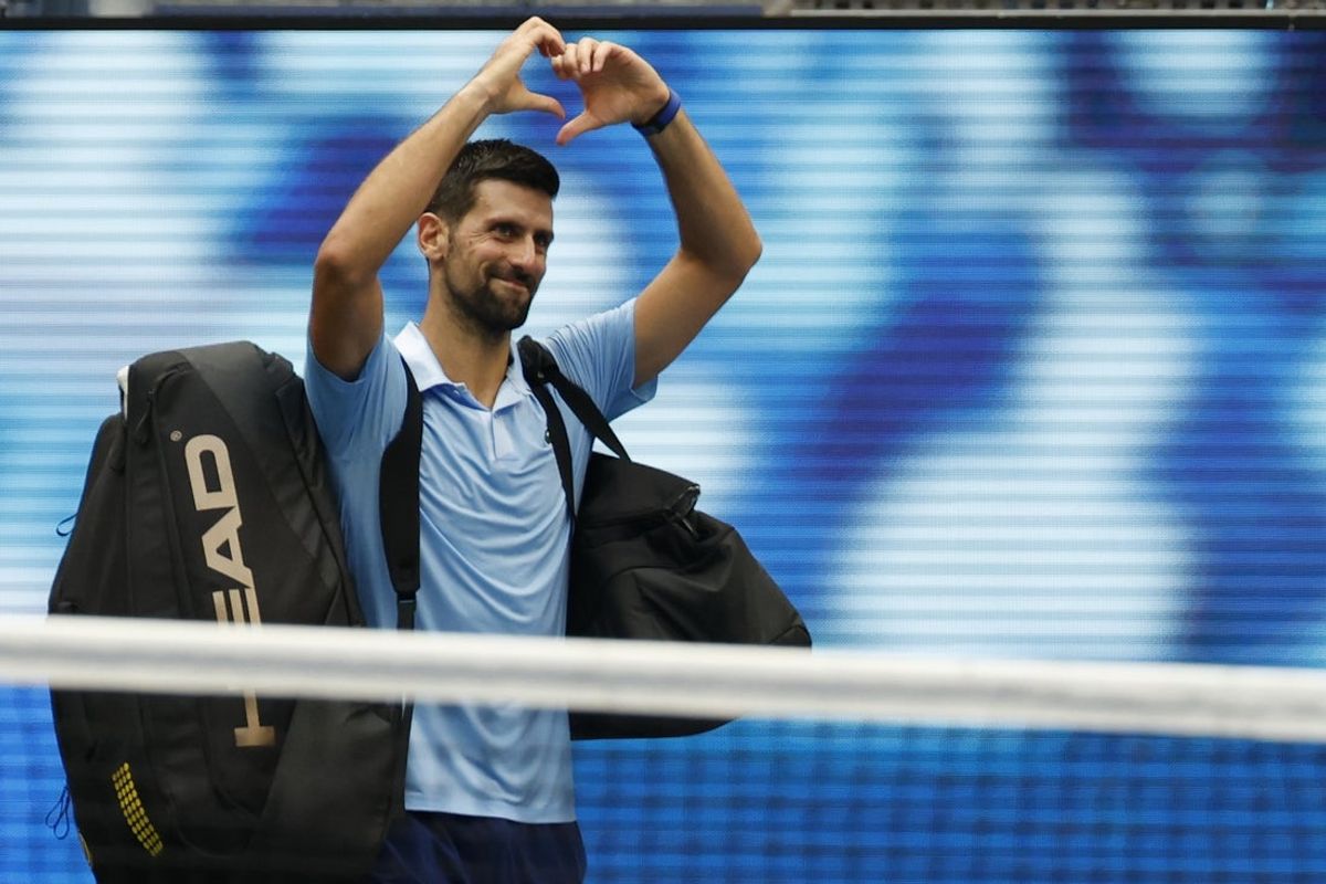 Sep 5, 2025; Flushing, NY, USA; Novak Djokovic (SRB) waves to the crowd while leaving the court after his match against Carlos Alcaraz (ESP) (not pictured) in a men's singles semifinal on day thirteen of the 2025 US Open tennis championships at USTA Billie Jean King National Tennis Center. Mandatory Credit: Geoff Burke-Imagn Images