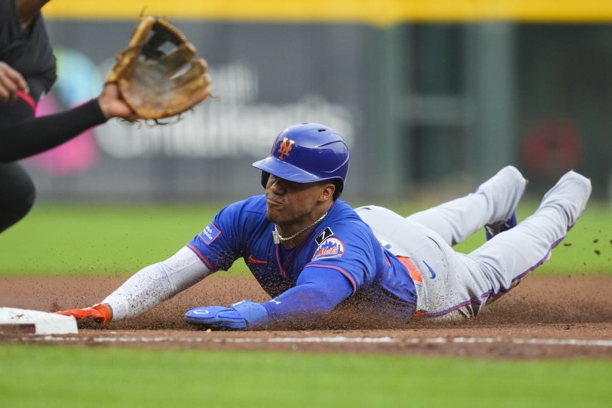 Sep 5, 2025; Cincinnati, Ohio, USA; New York Mets outfielder Juan Soto (22) steals third base against the Cincinnati Reds in the first inning at Great American Ball Park. Mandatory Credit: Aaron Doster-Imagn Images