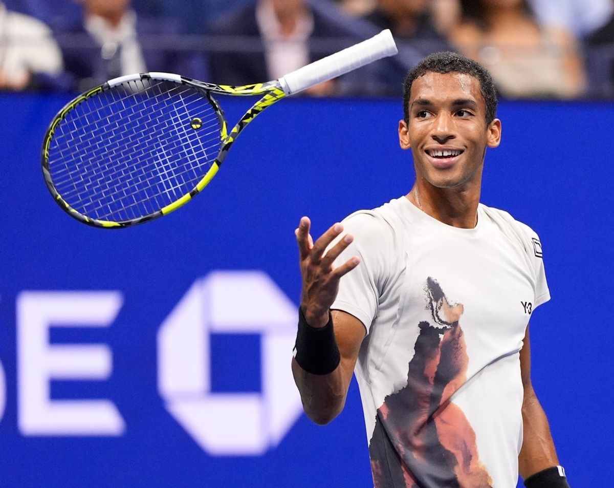 Sep 5, 2025; Flushing, NY, USA;  Felix Auger-Aliassime (CAN) reacts after a miss to Jannik Sinner (ITA) (not pictured) on day thirteen of the 2025 U.S. Open tennis tournament at the USTA Billie Jean King National Tennis Center. Mandatory Credit: Robert Deutsch-Imagn Images