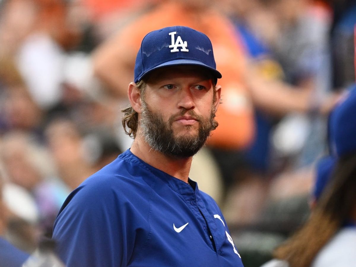 Sep 5, 2025; Baltimore, Maryland, USA;  Los Angeles Dodgers pitcher Clayton Kershaw (22) stands in the dugout before the game between the Baltimore Orioles and the Los Angeles Dodgers at Oriole Park at Camden Yards. Mandatory Credit: James A. Pittman-Imagn Images