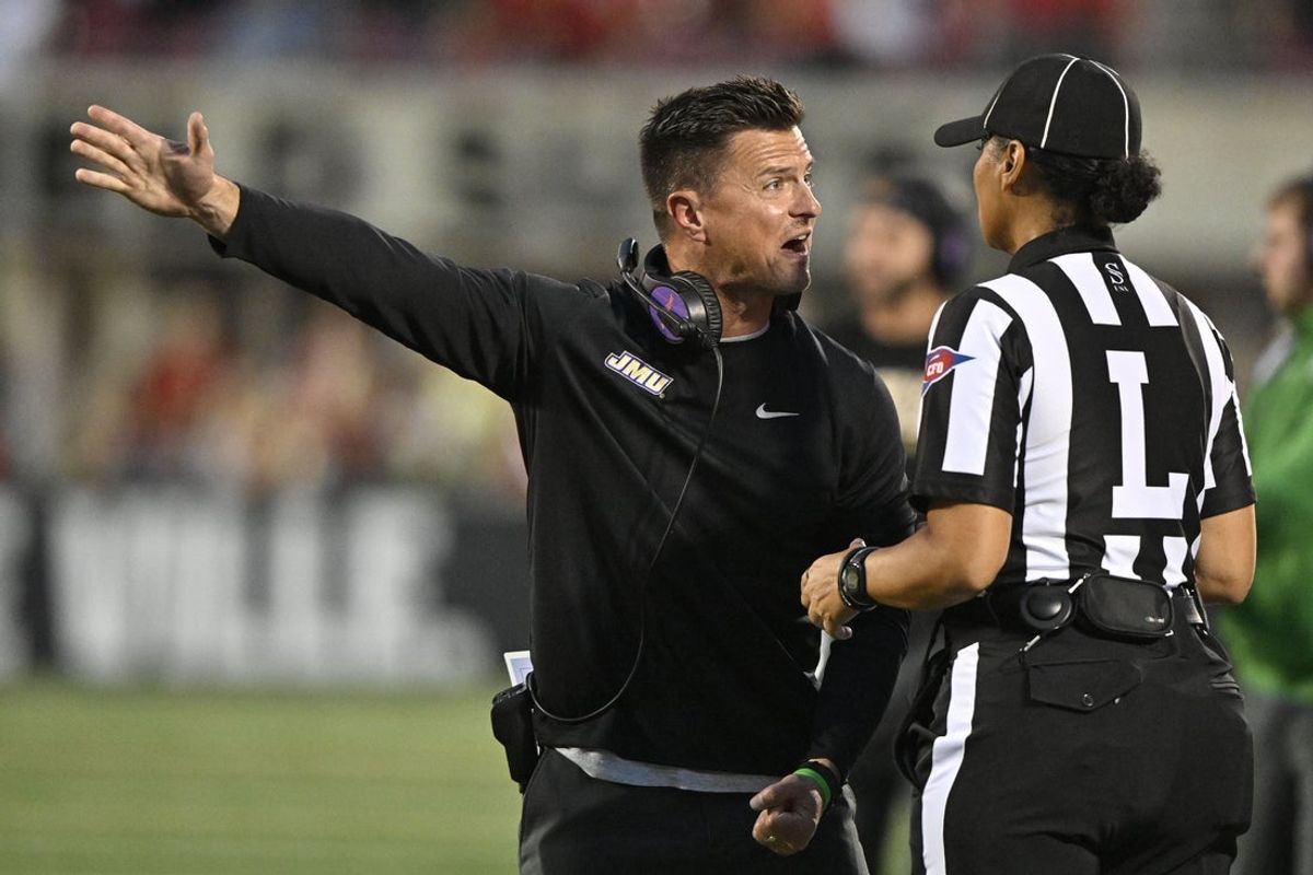 Sep 5, 2025; Louisville, Kentucky, USA;  James Madison Dukes head coach Bob Chesney argues a call with an official during the first half against the Louisville Cardinals at L&N Federal Credit Union Stadium. Mandatory Credit: Jamie Rhodes-Imagn Images