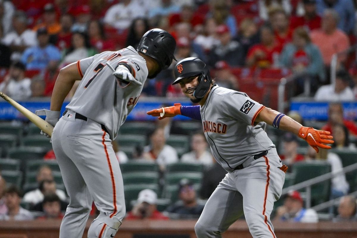 Sep 5, 2025; St. Louis, Missouri, USA;  San Francisco Giants shortstop Willy Adames (2) celebrates with first baseman Dominic Smith (7) after hitting a solo home run against the St. Louis Cardinals during the first inning at Busch Stadium. Mandatory Credit: Jeff Curry-Imagn Images