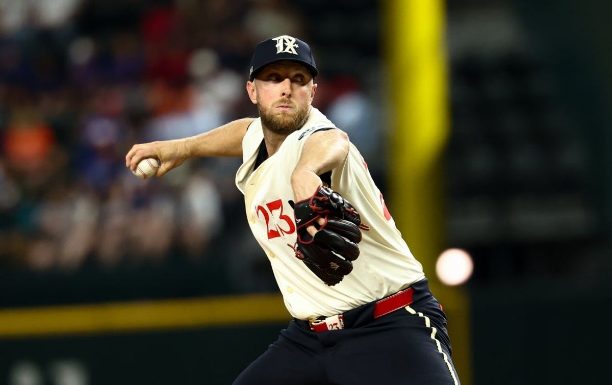 Sep 5, 2025; Arlington, Texas, USA;  Texas Rangers starting pitcher Merrill Kelly (23) throws during the fourth inning against the Houston Astros at Globe Life Field. Mandatory Credit: Kevin Jairaj-Imagn Images