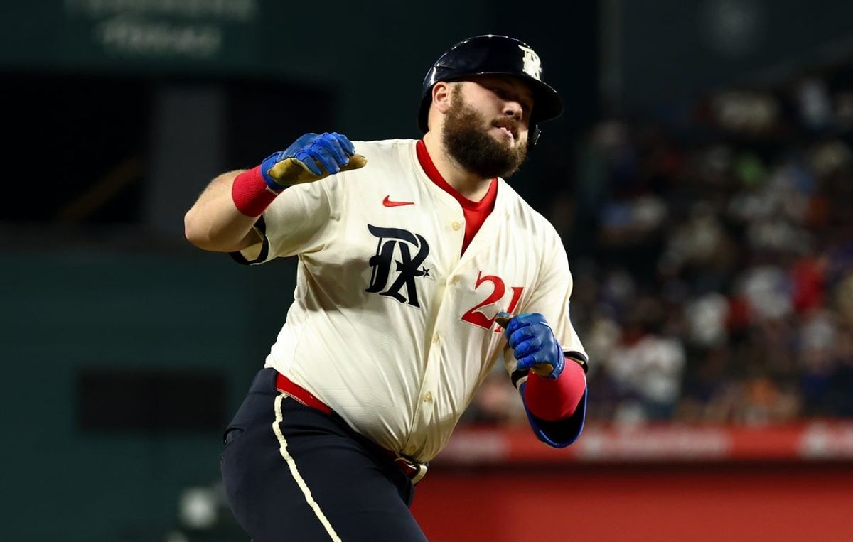 Sep 5, 2025; Arlington, Texas, USA;  Texas Rangers first baseman Jake Burger (21) runs the bases after hitting a two-run home run during the third inning against the Houston Astros at Globe Life Field. Mandatory Credit: Kevin Jairaj-Imagn Images