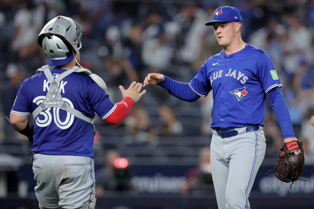 Sep 5, 2025; Bronx, New York, USA; Toronto Blue Jays relief pitcher Braydon Fisher (63) and catcher Alejandro Kirk (30) celebrate after defeating the New York Yankees at Yankee Stadium. Mandatory Credit: Brad Penner-Imagn Images