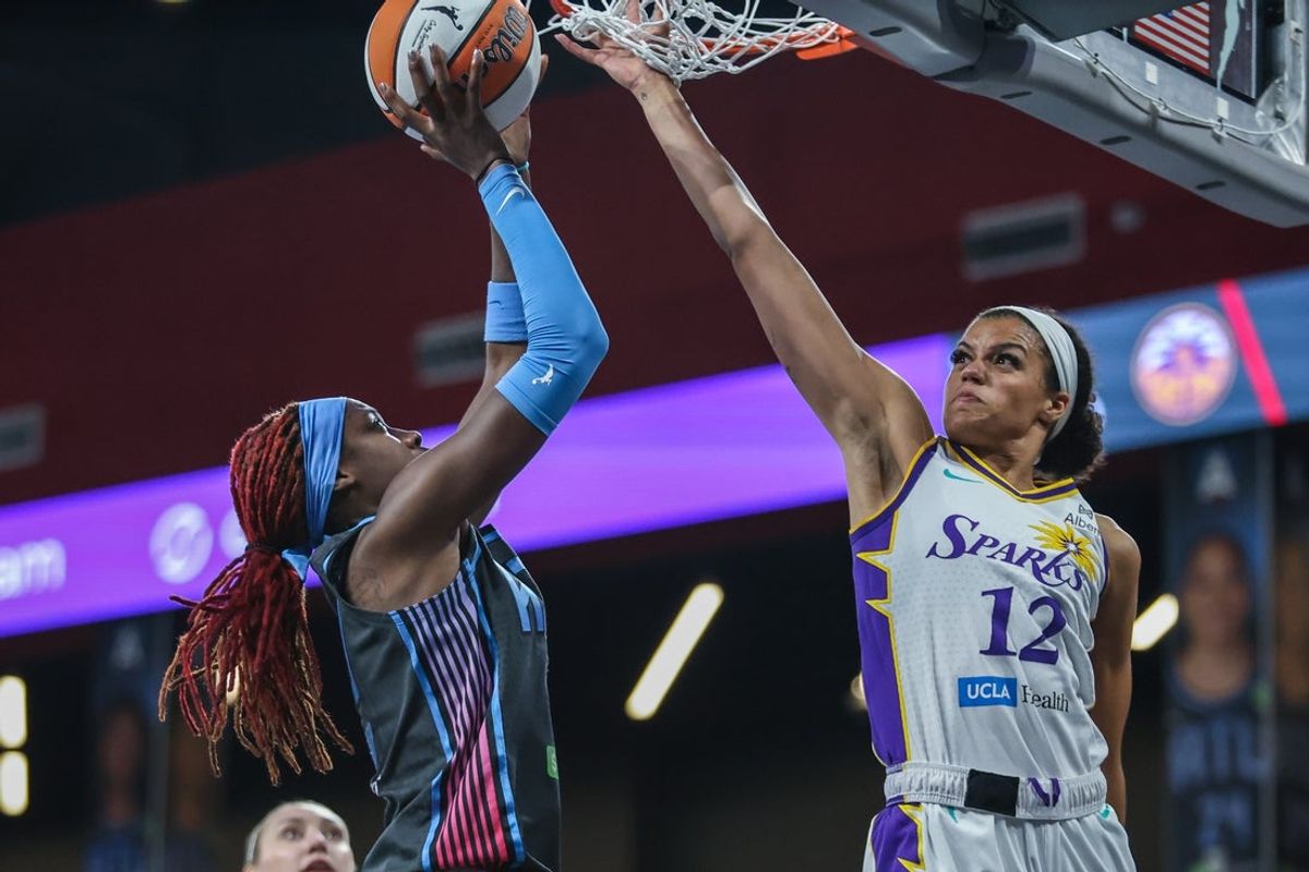 Sep 5, 2025; College Park, Georgia, USA; Atlanta Dream guard Rhyne Howard (10) attempts a shot against Los Angeles Sparks guard Rae Burrell (12) during the fourth quarter at Gateway Center Arena at College Park. Mandatory Credit: Jordan Godfree-Imagn Images
