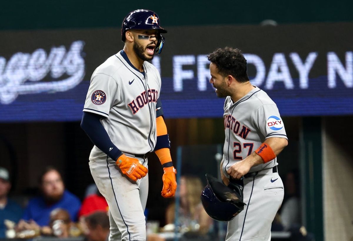 Sep 5, 2025; Arlington, Texas, USA;  Houston Astros third baseman Carlos Correa (1) celebrates with Houston Astros second baseman Jose Altuve (27) after hitting a two-run home run during the eighth inning against the Texas Rangers at Globe Life Field. Mandatory Credit: Kevin Jairaj-Imagn Images