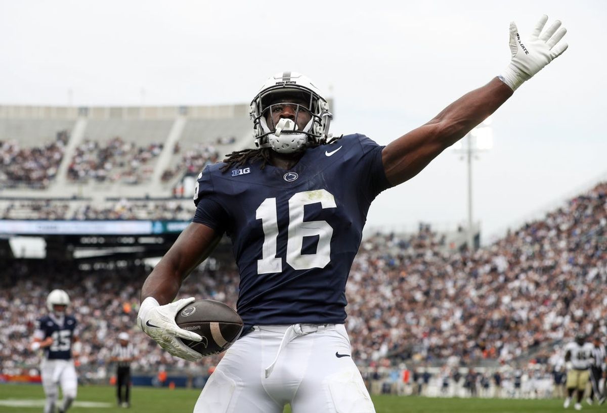Sep 6, 2025; University Park, Pennsylvania, USA; Penn State Nittany Lions tight end Khalil Dinkins (16) celebrates in the end zone after scoring a touchdown during the first quarter against the Florida International Panthers at Beaver Stadium. Mandatory Credit: Matthew O'Haren-Imagn Images