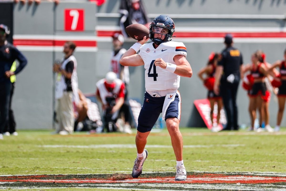 Sep 6, 2025; Raleigh, North Carolina, USA; Virginia Cavaliers quarterback Chandler Morris (4) prepares to throw the football during the first half of the game against North Carolina State Wolfpack at Carter-Finley Stadium. Mandatory Credit: Jaylynn Nash-Imagn Images