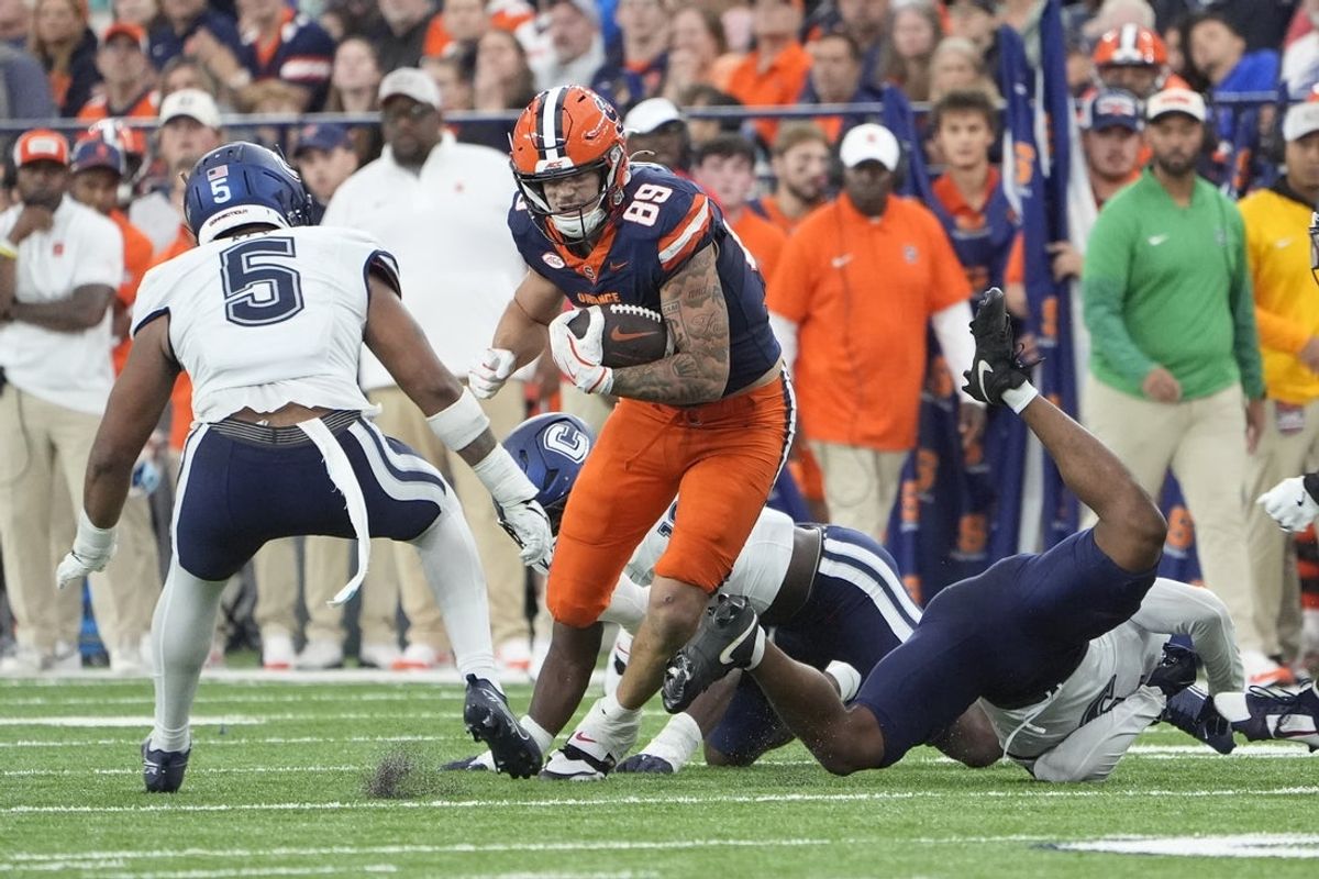 Sep 6, 2025; Syracuse, New York, USA; Syracuse Orange tight end Dan Villari (89) runs against UConn Huskies linebacker Aaron Key (5) during the first half at JMA Wireless Dome. Mandatory Credit: Gregory Fisher-Imagn Images