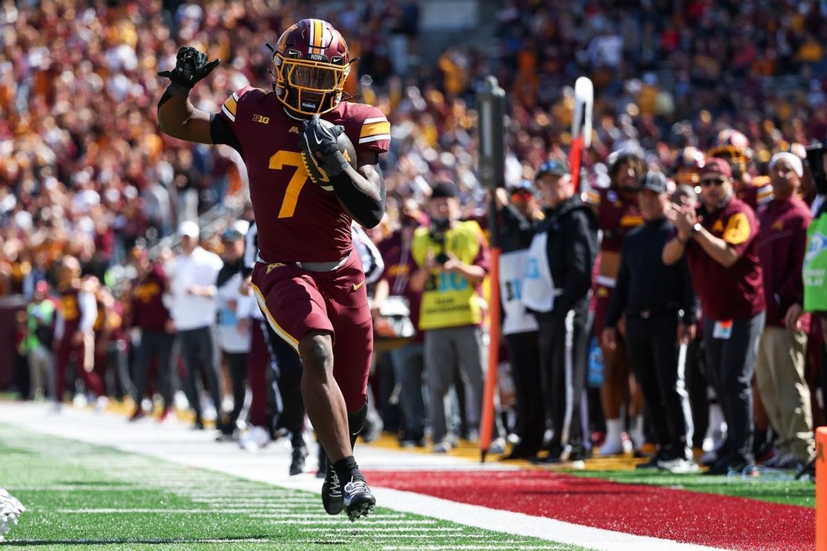 Sep 6, 2025; Minneapolis, Minnesota, USA; Minnesota Golden Gophers wide receiver Legend Lyons (7) runs for a touchdown against the Northwestern State Demons during the second quarter at Huntington Bank Stadium. Mandatory Credit: Matt Krohn-Imagn Images
