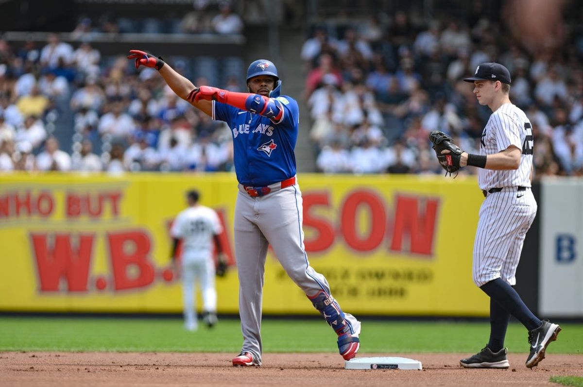 Sep 6, 2025; Bronx, New York, USA; Toronto Blue Jays first baseman Vladimir Guerrero Jr. (27) reacts after hitting a double against the New York Yankees during the first inning at Yankee Stadium. Mandatory Credit: John Jones-Imagn Images