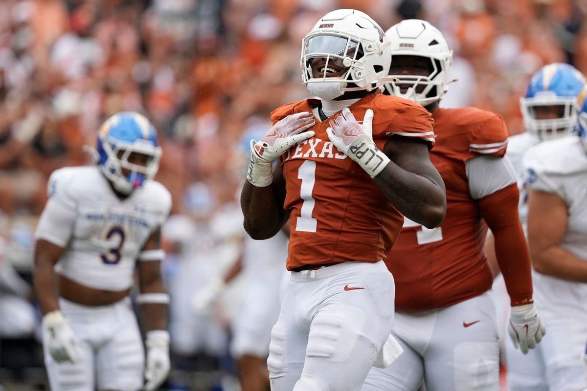 Sep 6, 2025; Austin, Texas, USA; Texas Longhorns defensive lineman Colin Simmons (1) reacts after making a tackle during the first half against the San Jose Spartans at Darrell K Royal-Texas Memorial Stadium. Mandatory Credit: Scott Wachter-Imagn Images
